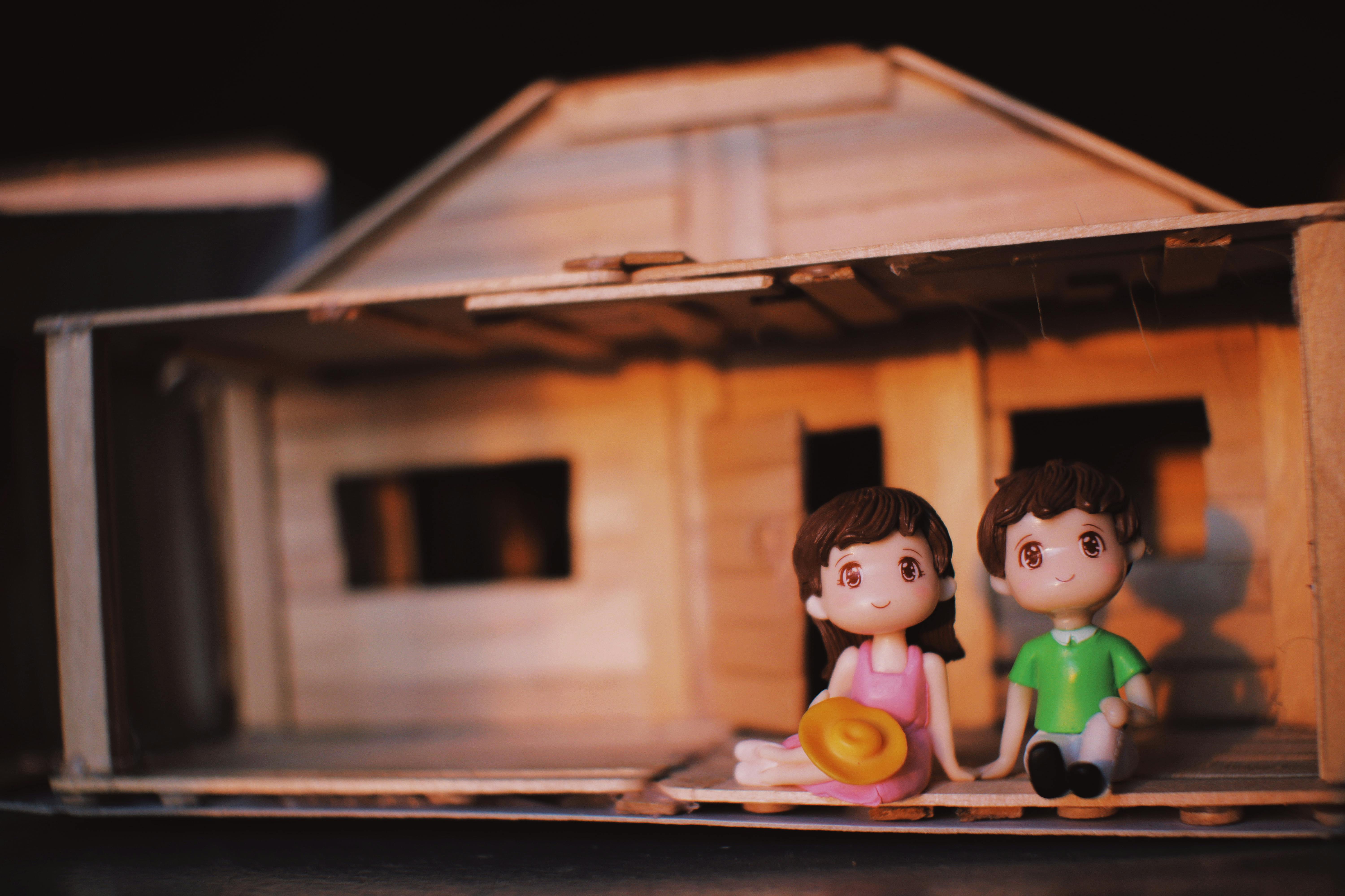 couple figurines in decorative house