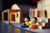 Couple figurines near toy structure