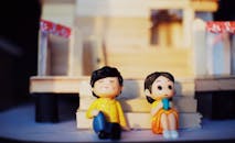 Figurines near decorative wooden stairs