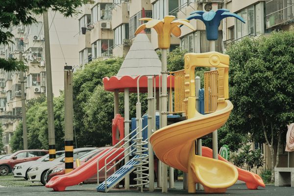 Colourful outdoor playground with slides, photo by 张子铭 on Pexels