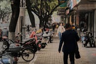 People Walking on the Stone Paved Street