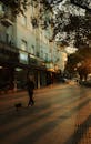 Man Walking on the Sidewalk with His Dog