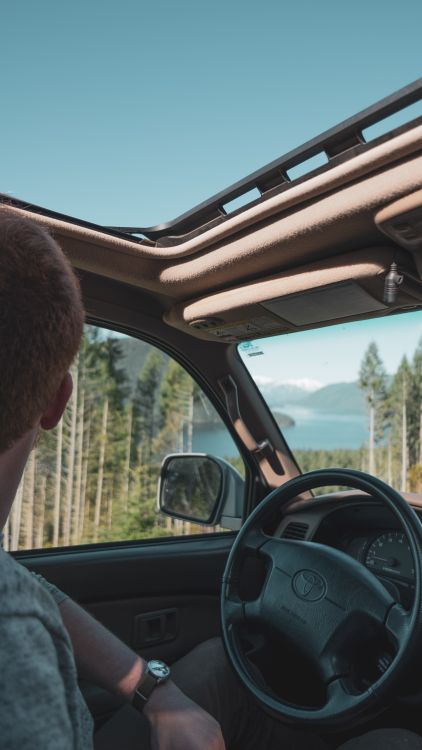Close-Up Shot of a Person inside the Car · Free Stock Photo