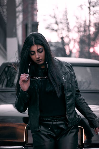 Authentic smiling young beautiful girl in fashionable clothes. Hipster style.  Woman in sunglasses, black cap and leather jacket. Real people emotions.  photo – Leather Image on Unsplash