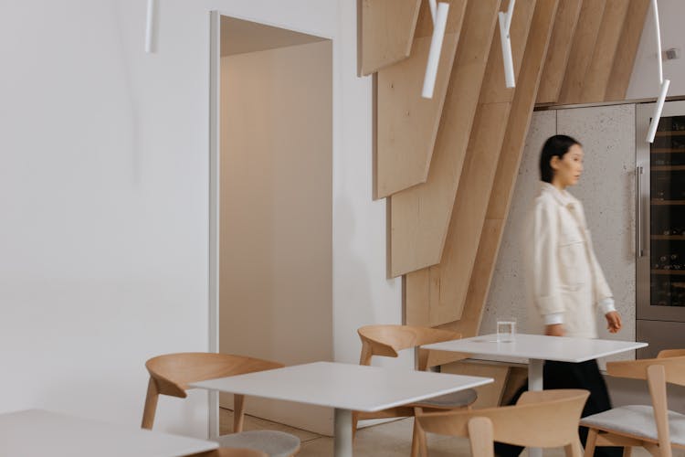 A Woman Walking Indoors