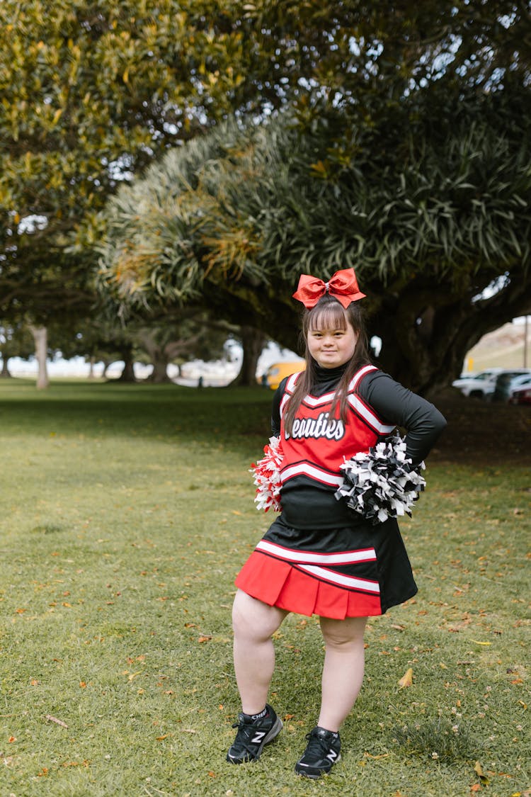 A Woman In Cheerleader Outfit Standing