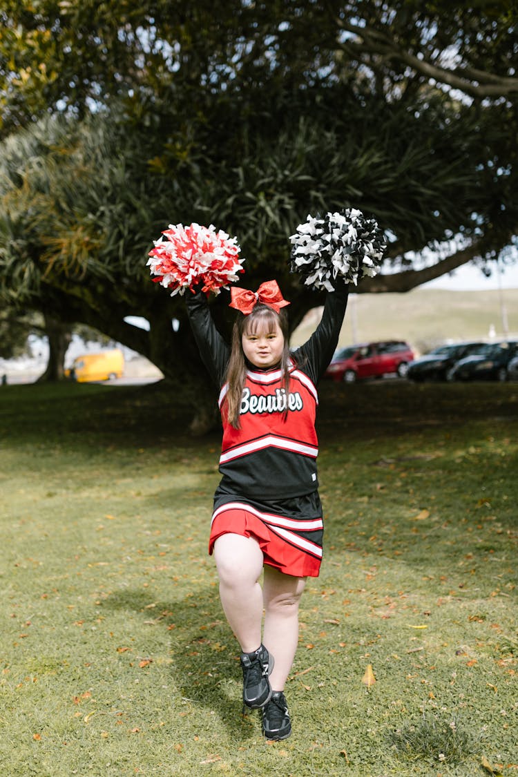 A Woman In Cheerleader Outfit Standing