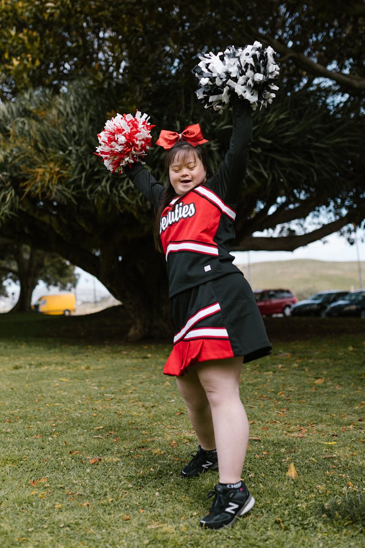 A Woman In Cheerleader Outfit Dancing