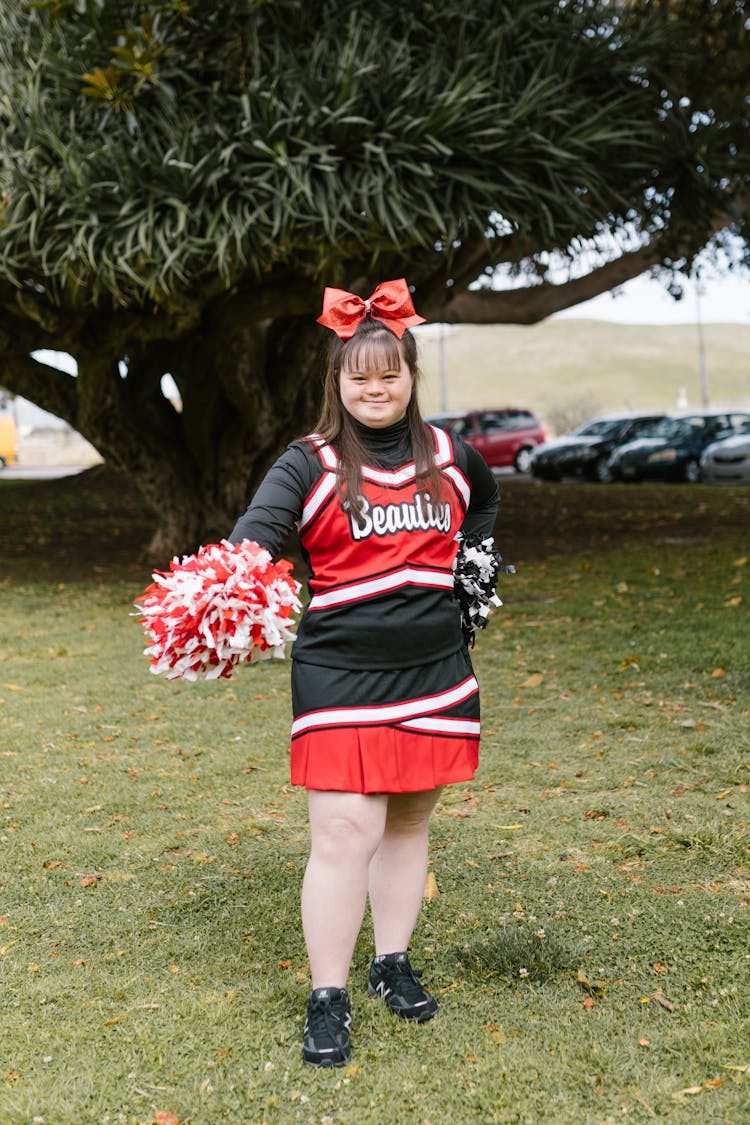 A Woman In Cheerleader Outfit Dancing