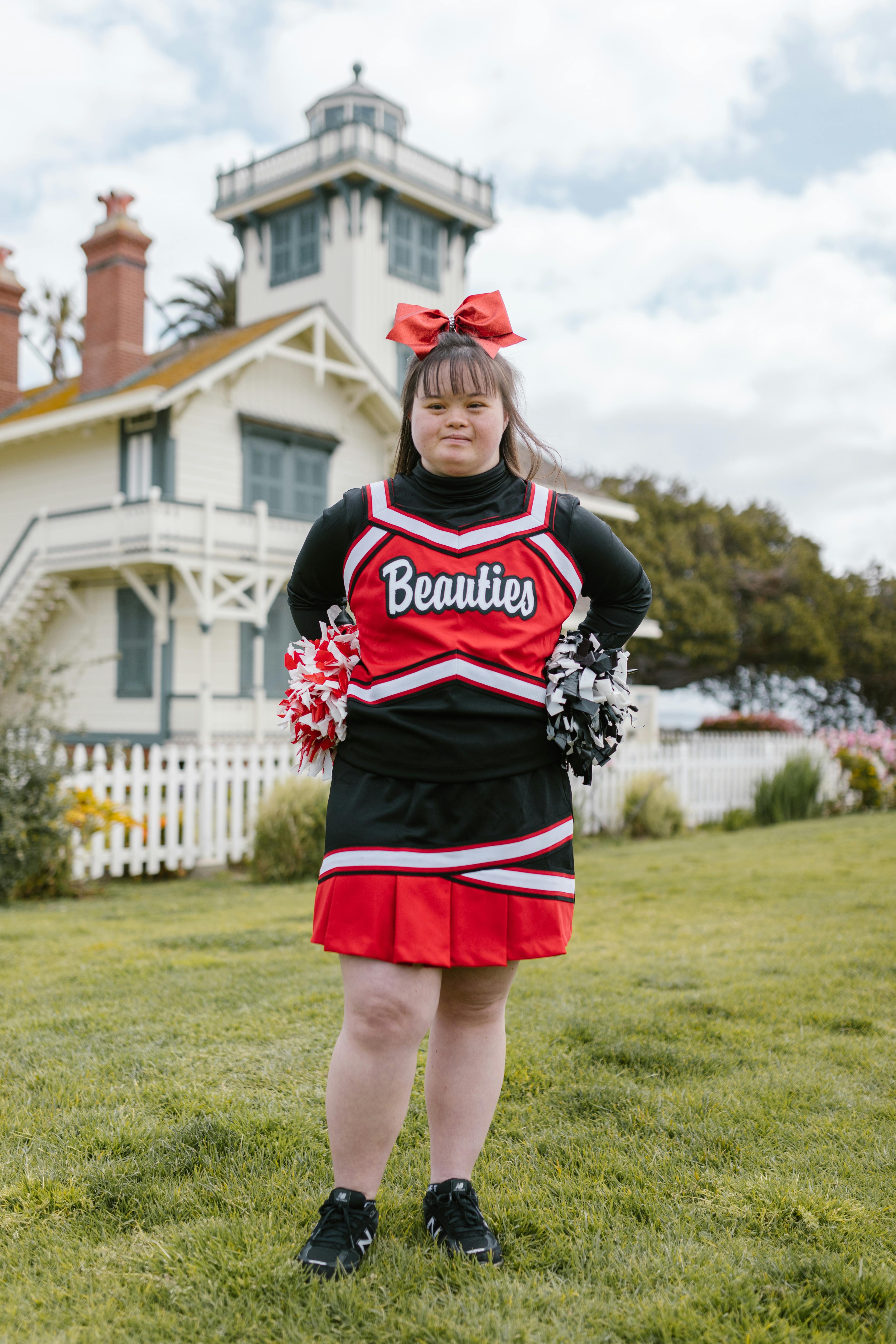 A Woman in Cheerleader Outfit Standing Outside · Free Stock Photo