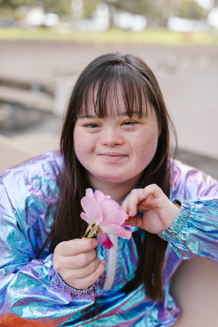 Beautiful Woman Holding A Flower