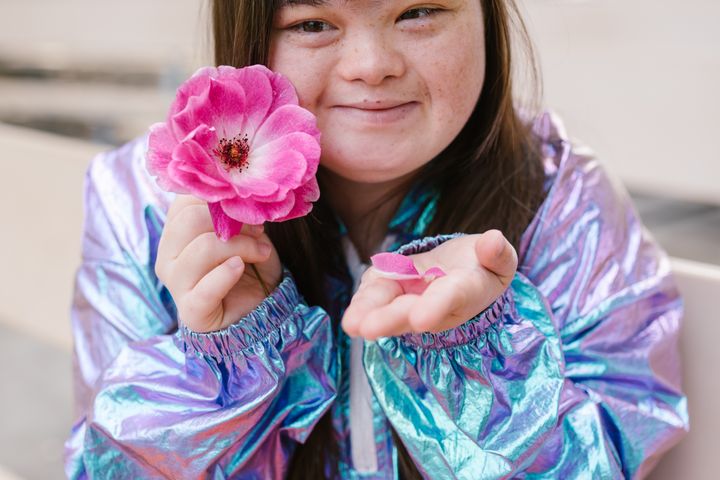 Beautiful Woman Holding a Flower