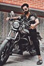 Bearded Man Riding Black Motorcycle