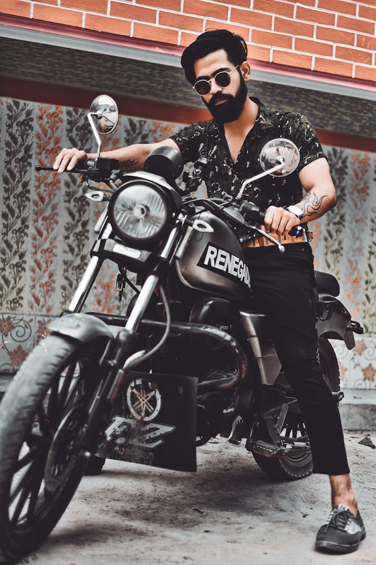 Bearded Man Riding Black Motorcycle