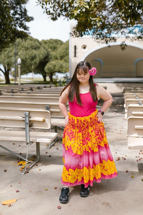 A Girl in a Floral Dress with Her Hands on Her Waist