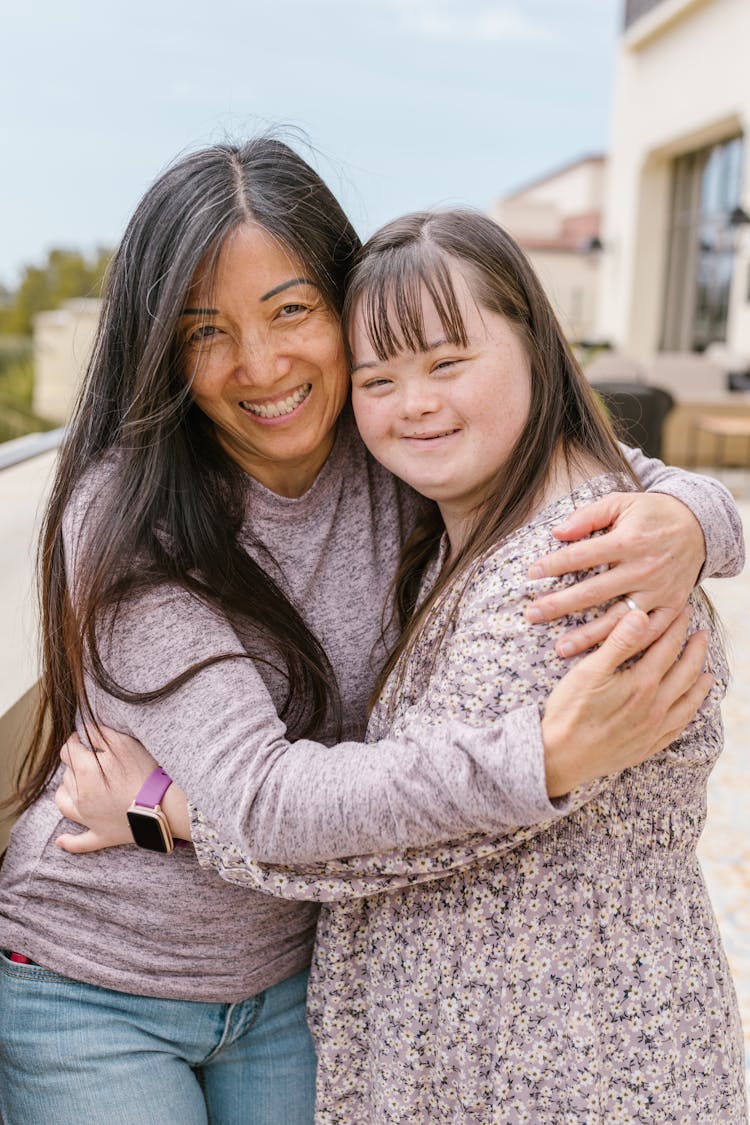 Mother Hugging Her Daughter