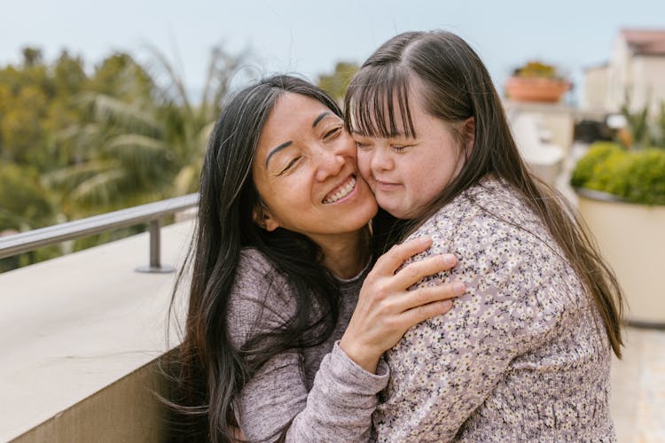 Mother Hugging Her Daughter