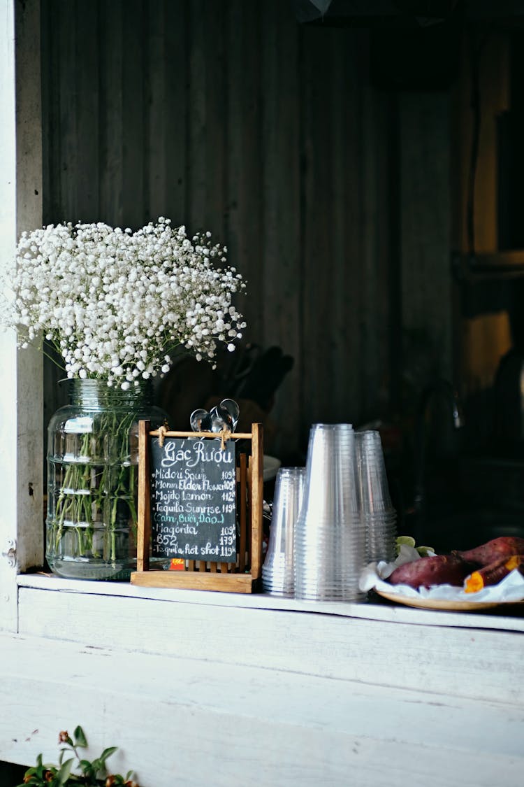 White Flowers On A Bar Counter