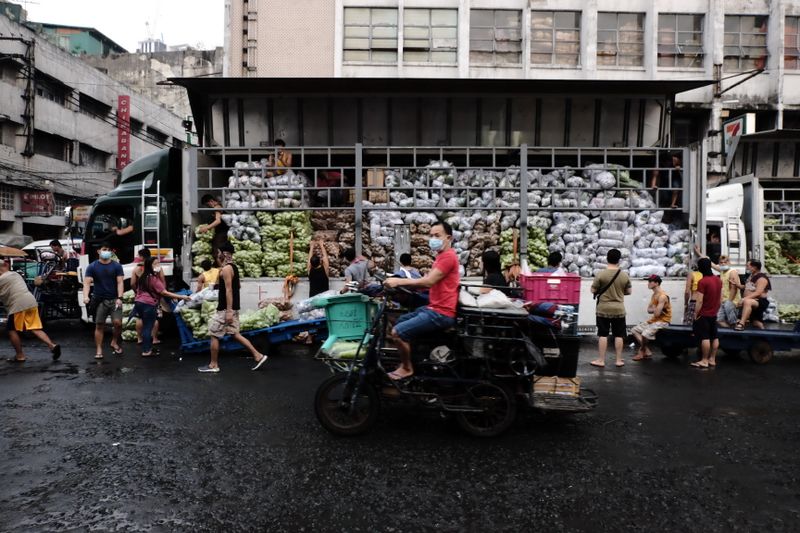 People gathered at a busy food market