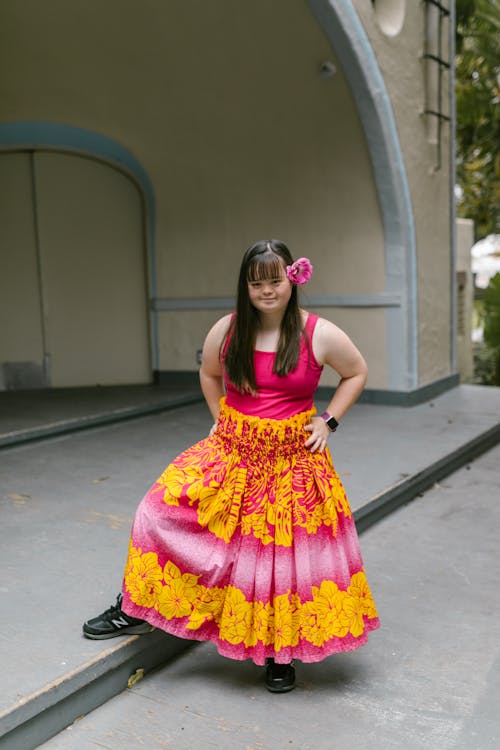 A Girl in Floral Skirt Posing on a Stage