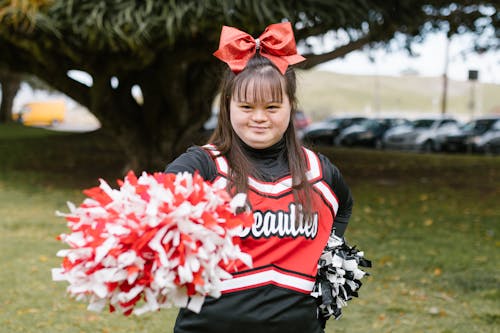 A Cheerleader Holding Pompoms