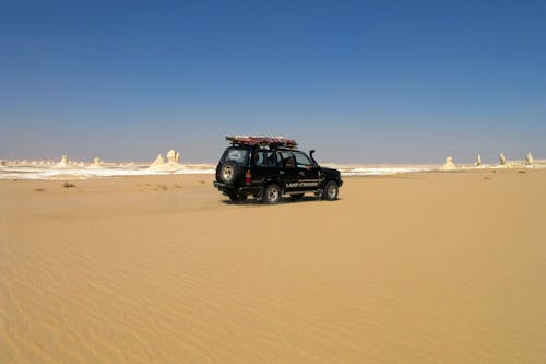 Free A Sports Utility Vehicle on the Desert Stock Photo