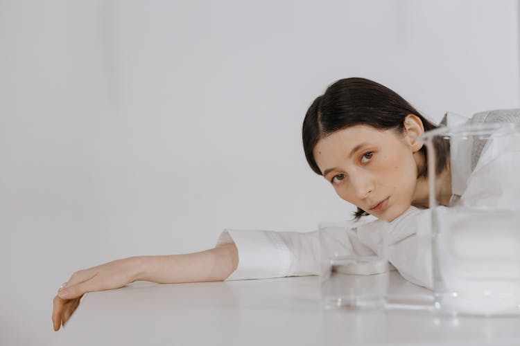 A Woman Leaning On The Table