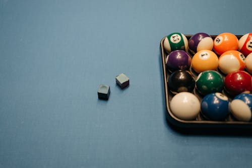 Free Billiard Balls and Chalks on the Billiard Table Stock Photo