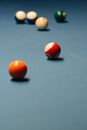 Red and White Ball on Blue Billiard Table