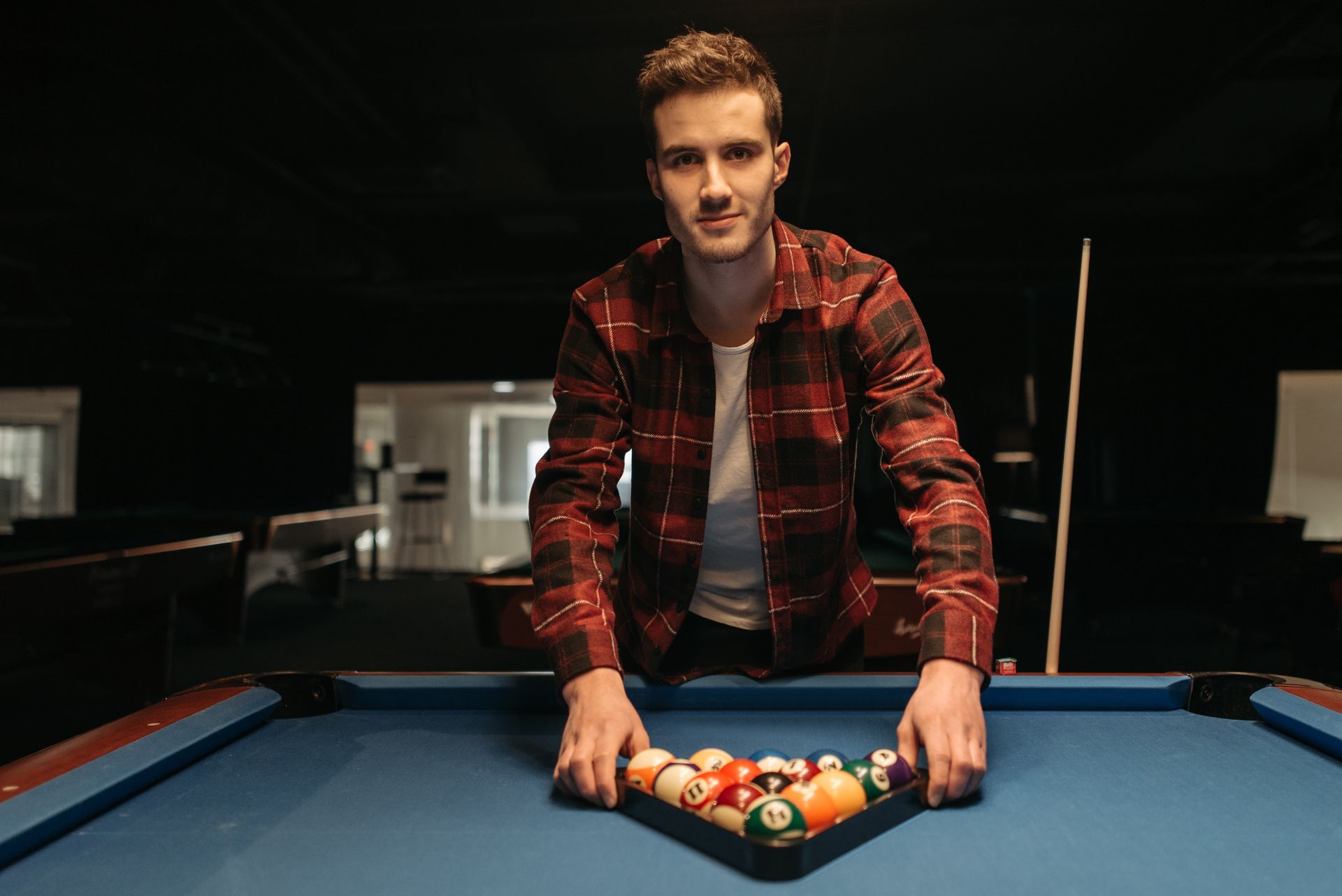 A Man Setting Up the Billiard Table