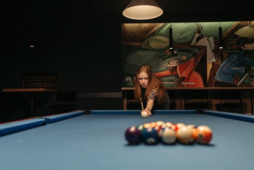A Woman Playing Billiards