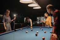 Man in Black Long Sleeve Shirt Playing Billiard