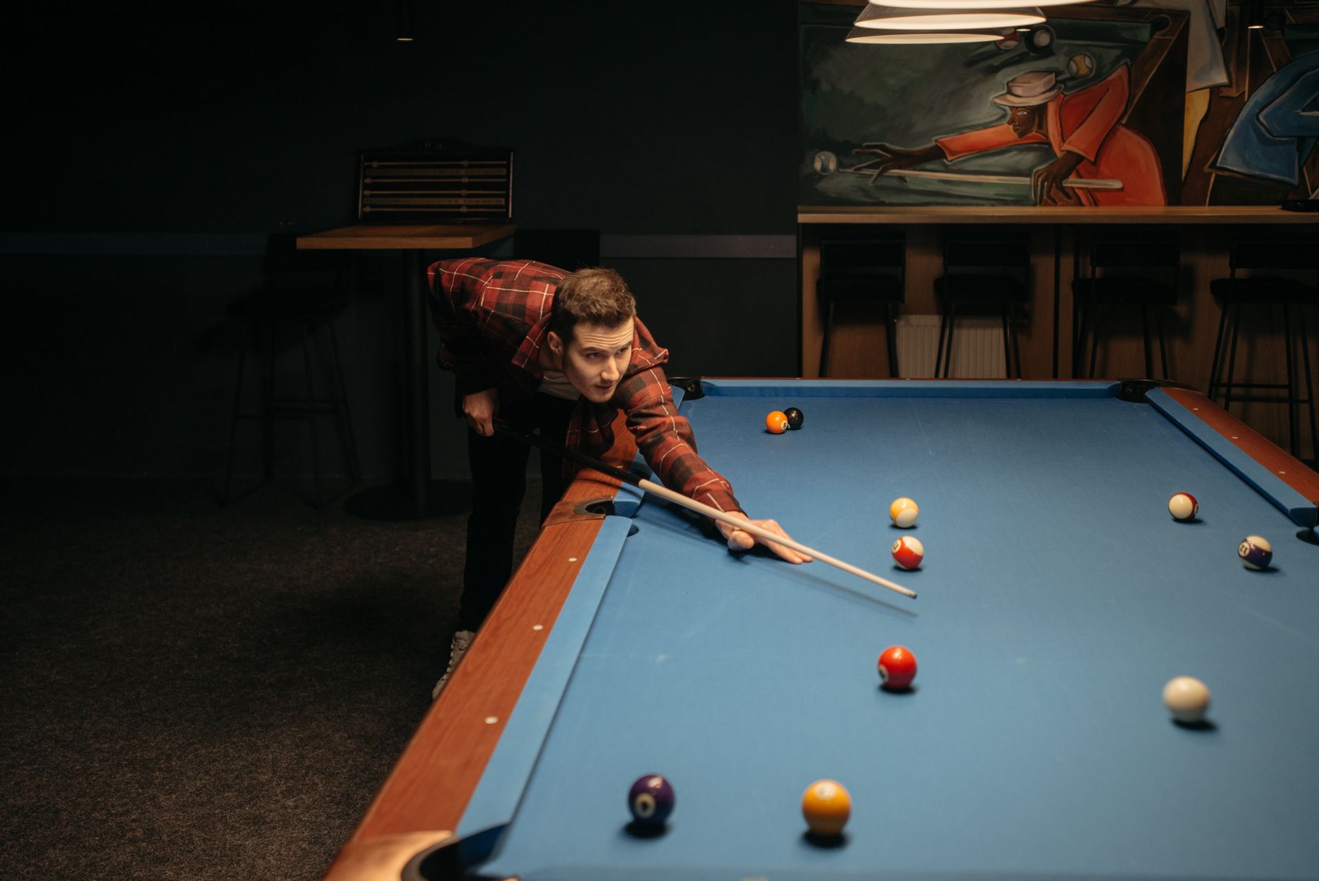A Man Playing Billiards