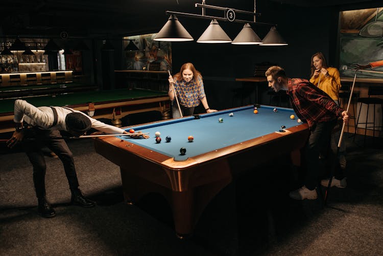 Friends Playing Billiards Together