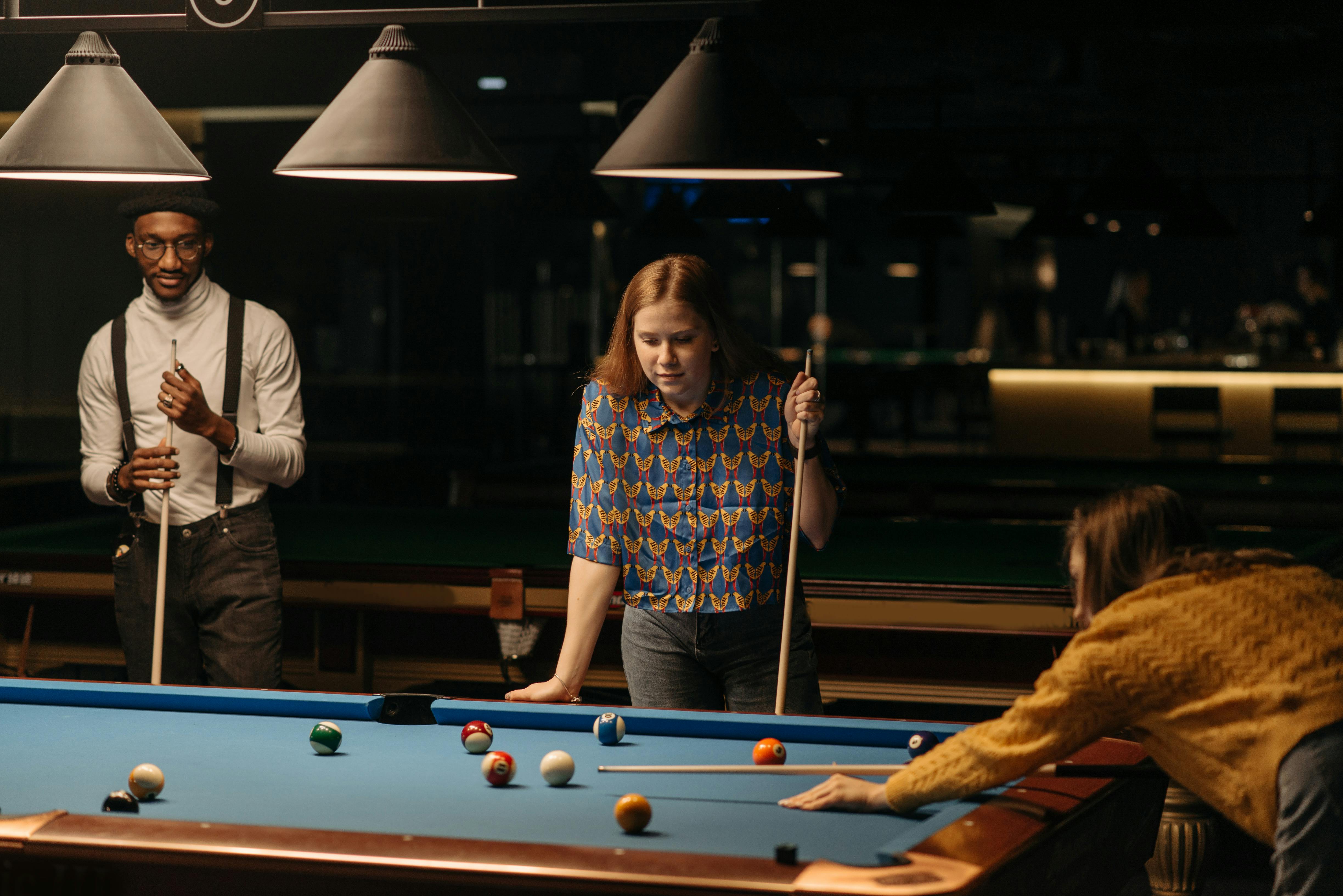 Friends play billiards., Stock image