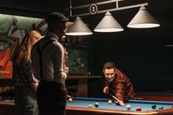 Friends Training and Playing Billiards