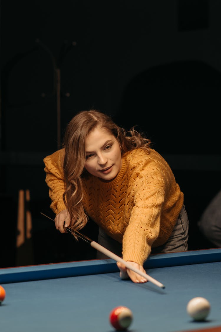 A Woman Playing Billiards