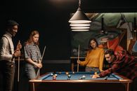 Friends Training and Playing Billiards