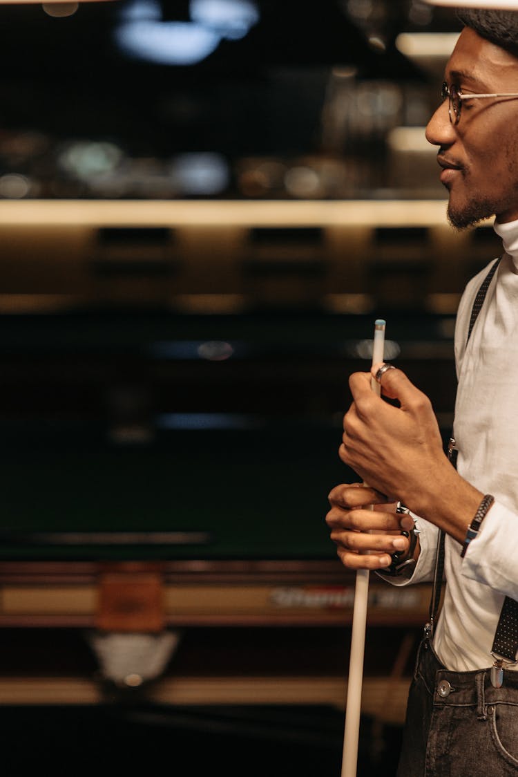 Man Holding A Cue Stick