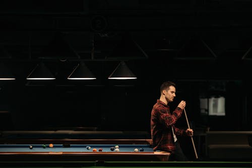 A Man Playing Billiard 