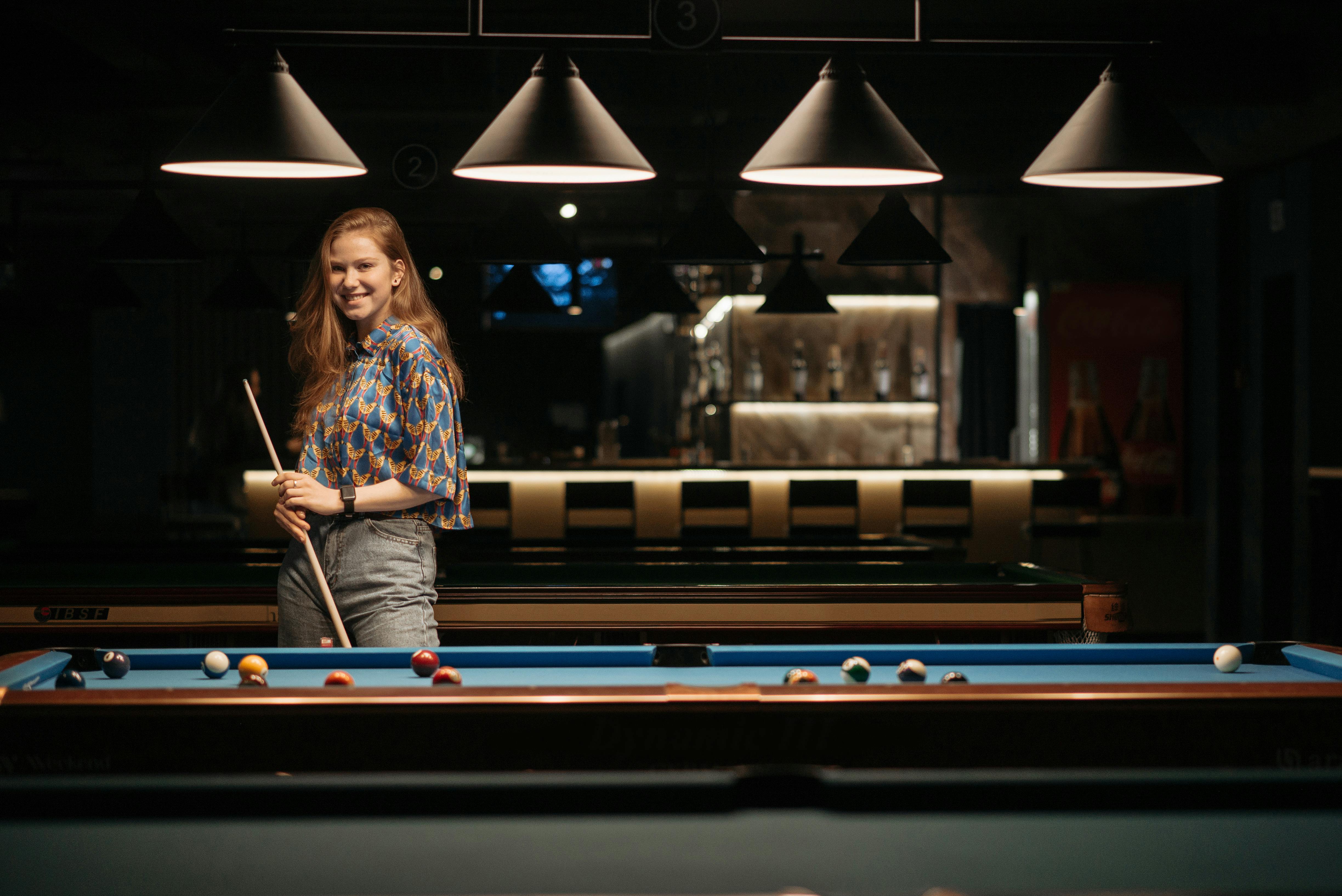 woman posing with cue stick