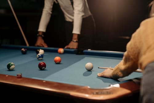 People Playing the Game of Billiard