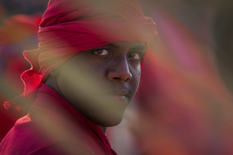 Portrait Of A Man Wearing A Red Turban