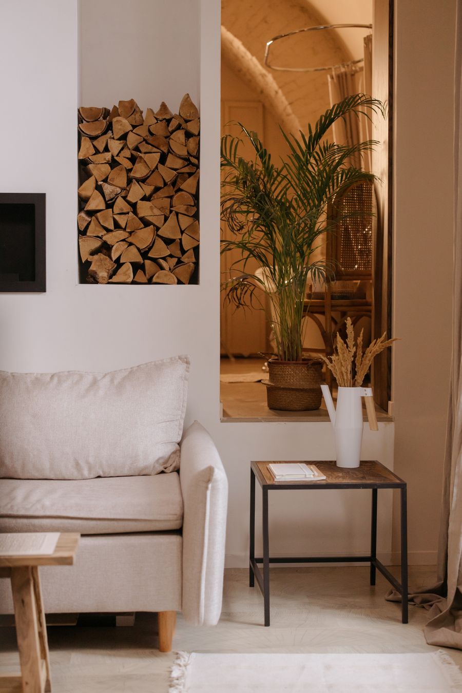 Staged living room with fireplace and beige sofa