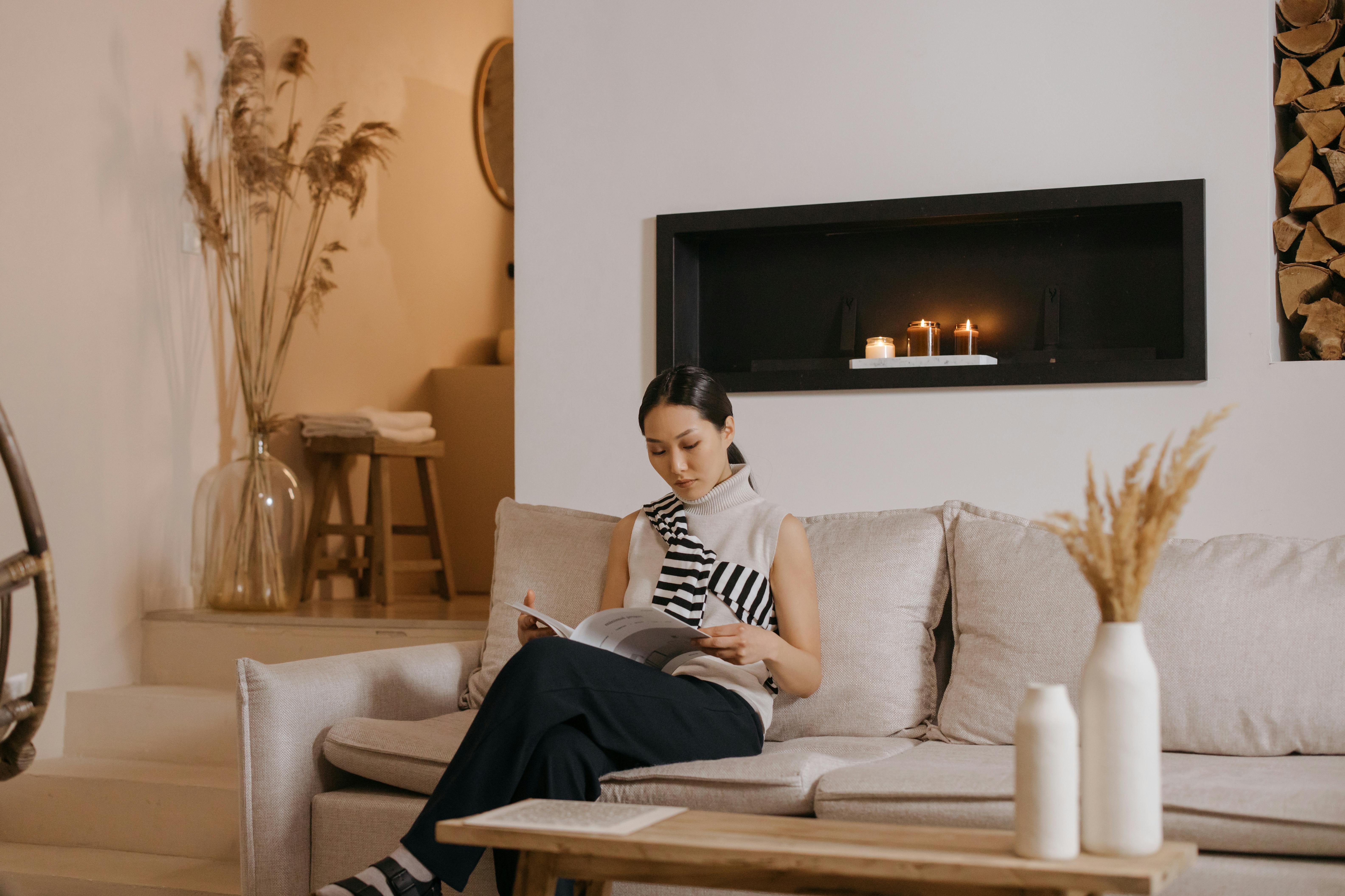 Woman lounging on her beige sofa