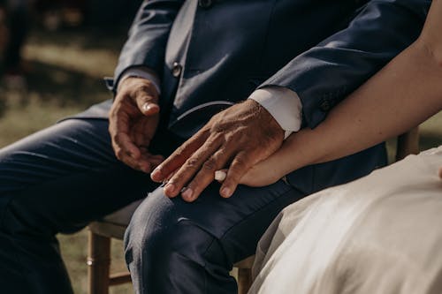 Free Close up Shot of a Wedding Couple Holding Hands Stock Photo