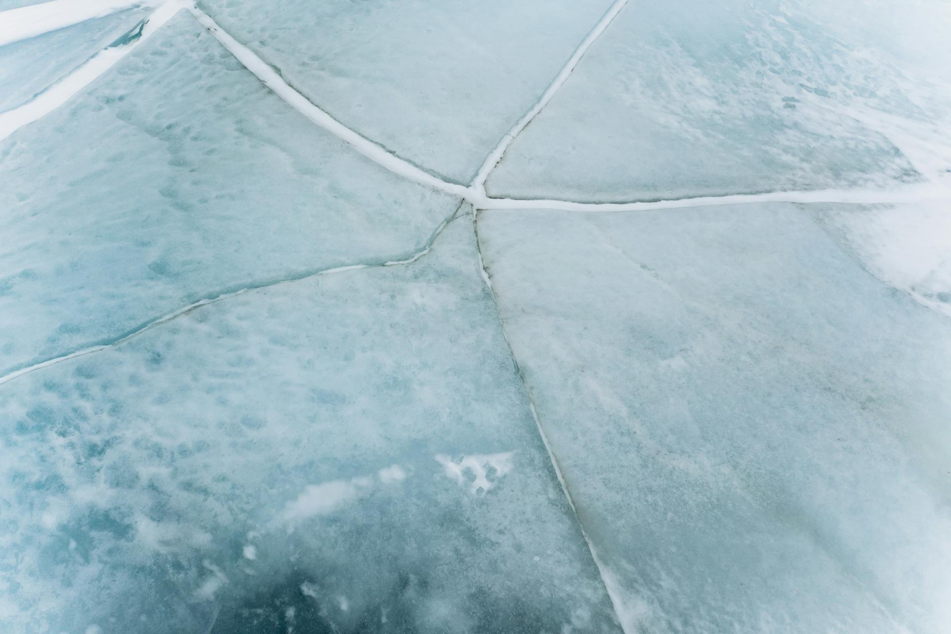 Close up Shot of Cracks on a Frozen Body of Water