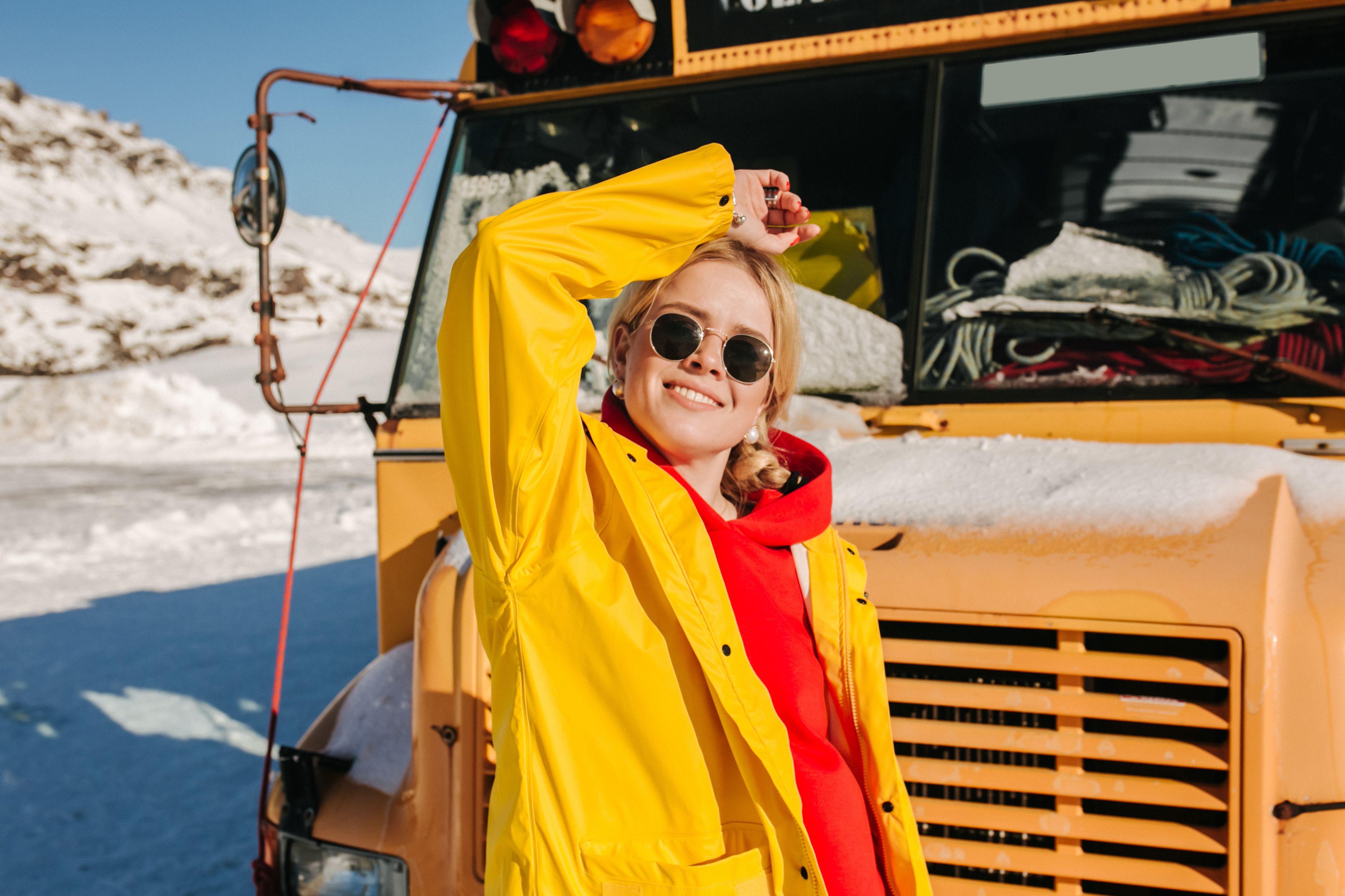 Smiling Woman in Yellow Jacket and Sunglasses · Free Stock Photo