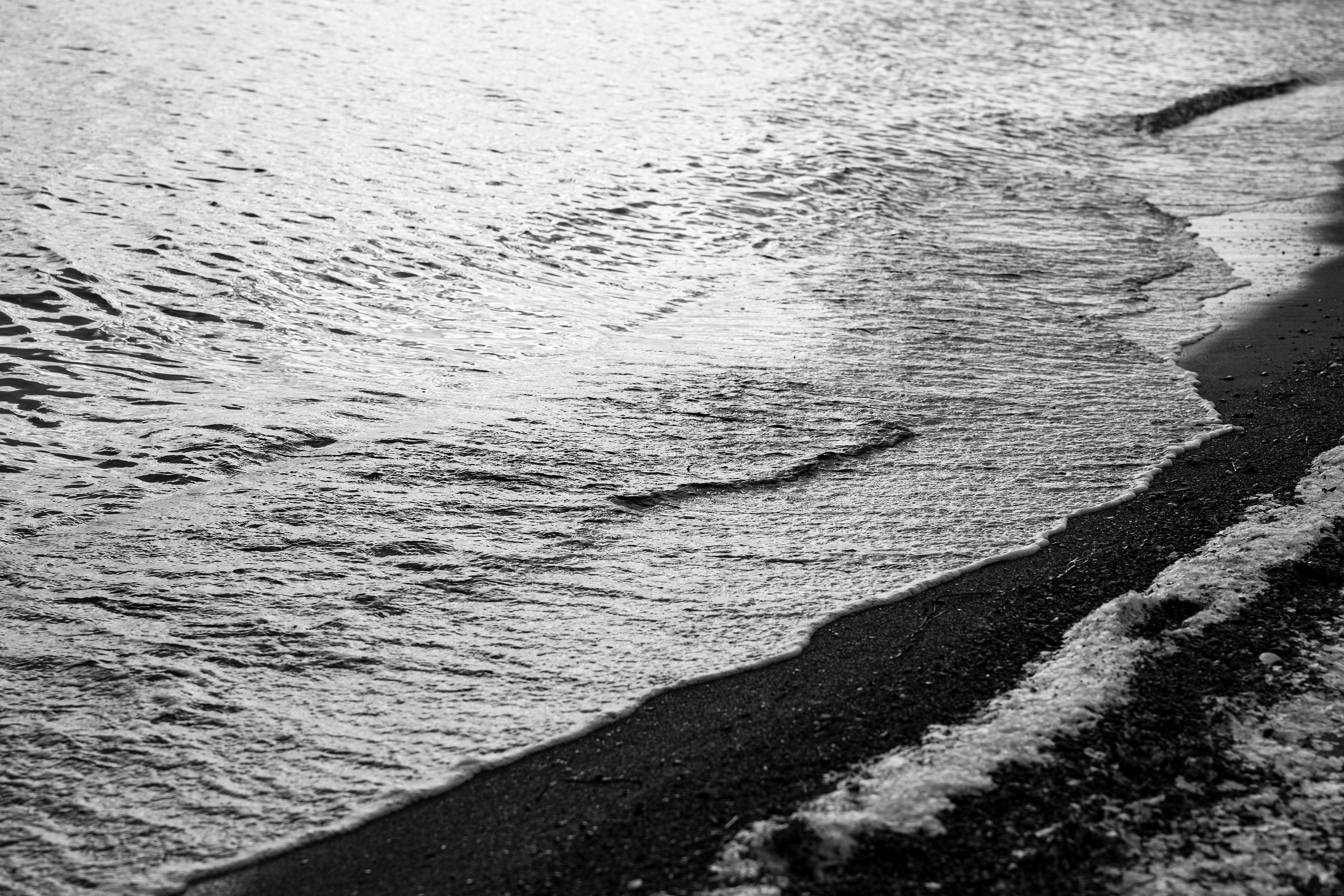 Black and white image capturing the serene shoreline of the Baltic Sea at Ostseebad Boltenhagen.