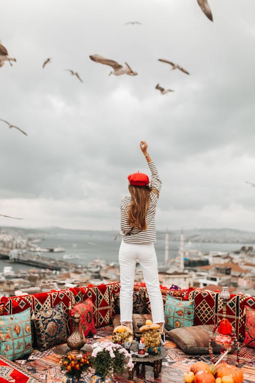 Free Back View of a Woman Posing on a Rooftop  Stock Photo